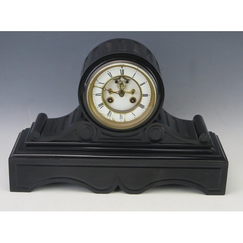 1114 - A late Victorian polished slate mantel clock, the drum-shaped case with 11cm Roman dial, the movemen... 