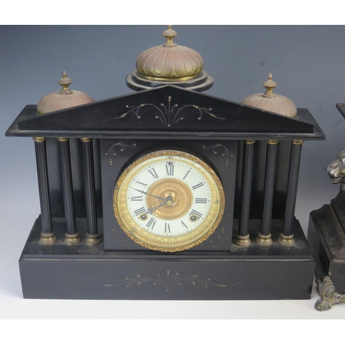 1121 - A late Victorian polished slate mantel clock of architectural outline, with three domes, to the pedi... 