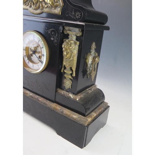 1125 - A large late Victorian polished slate mantel clock of arched outline, with applied gilt metal female... 