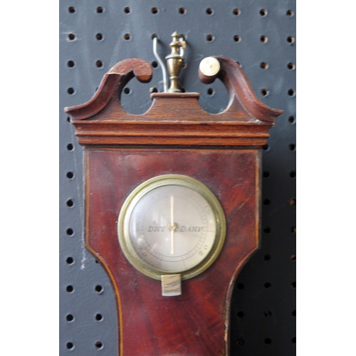 1127 - L. Solomons, Bath, a 19th century mahogany and boxwood strung wheel barometer, with broken swan neck... 