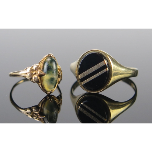 113 - A 9ct Gold Signet Ring mounted with gold banded black onyx (size T.25, 2.6g), a moss agate ring stam... 