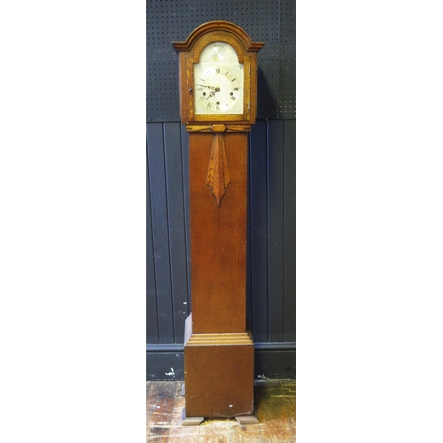 1130 - An oak cased dwarf longcase clock of arched outline, with 18cm arched silvered Roman dial, the tripl... 