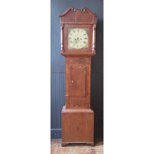 1133 - An early 19th century  mahogany, oak and crossbanded longcase clock, the arched hood with broken swa... 