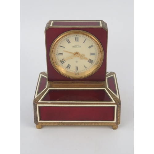 1138 - Angelus, a gilt metal and enamel eight-day musical alarm clock, with 4.5cm Roman dial, the square ca... 