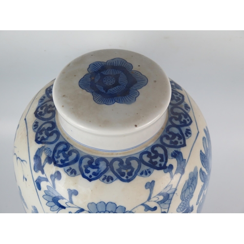 1157 - A Chinese blue and white ovoid vase and cover, with panels decorated with partridge amongst flowerin... 