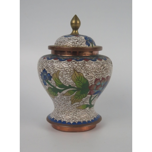 1159 - A Chinese cloisonné jar and cover, of ovoid outline with domed cover, decorated with floral decorati... 