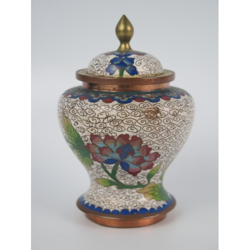 1159 - A Chinese cloisonné jar and cover, of ovoid outline with domed cover, decorated with floral decorati... 