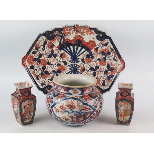 1161 - An Imari porcelain dish of lozenge-shaped outline, decorated in traditional floral designs, 37cm wid... 