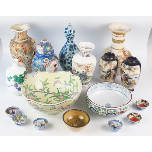 1166 - A mixed collection of Chinese and Japanese ceramics including vases bowls sake bowls, crackle glaze ... 