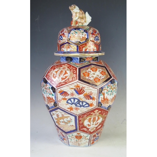 1168A - A Japanese Imari porcelain vase and cover of baluster form with co-joined octagonal panels, decorate... 