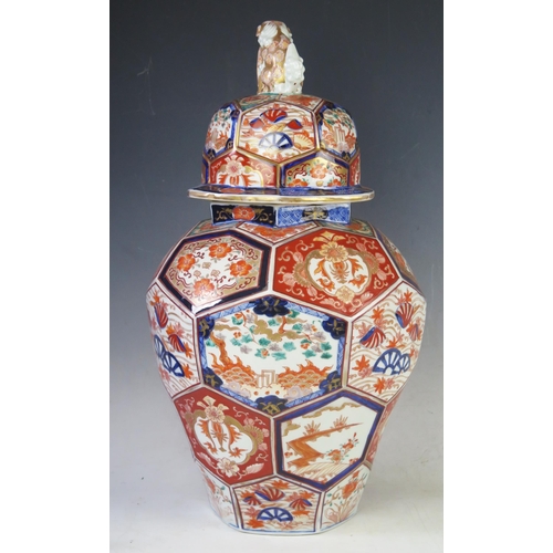 1168A - A Japanese Imari porcelain vase and cover of baluster form with co-joined octagonal panels, decorate... 