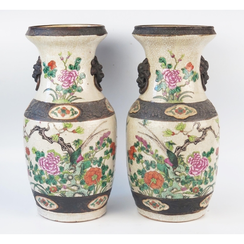 1170 - A pair of Chinese crackle glaze vases, of ovoid form decorated with exotic birds amongst flowering s... 