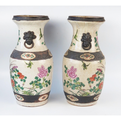 1170 - A pair of Chinese crackle glaze vases, of ovoid form decorated with exotic birds amongst flowering s... 