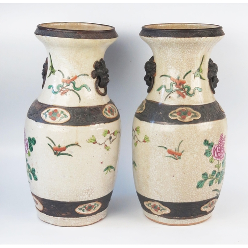 1170 - A pair of Chinese crackle glaze vases, of ovoid form decorated with exotic birds amongst flowering s... 