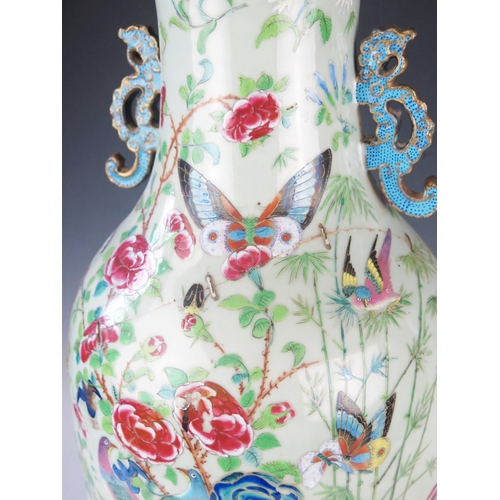 1170A - Large Chinese Famille Rose Vase, the central decoration depicts figures collecting butterflies and i... 