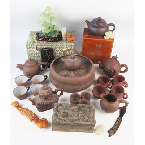 1171 - A collection of Chinese Yixing tea wares, includes tea pots, cups, jug and dishes, together with jad... 