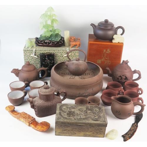 1171 - A collection of Chinese Yixing tea wares, includes tea pots, cups, jug and dishes, together with jad... 