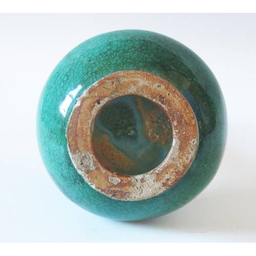 1175 - A Chinese crackle glaze pottery bottle vase, with celadon green ground, having a slender neck a squa... 