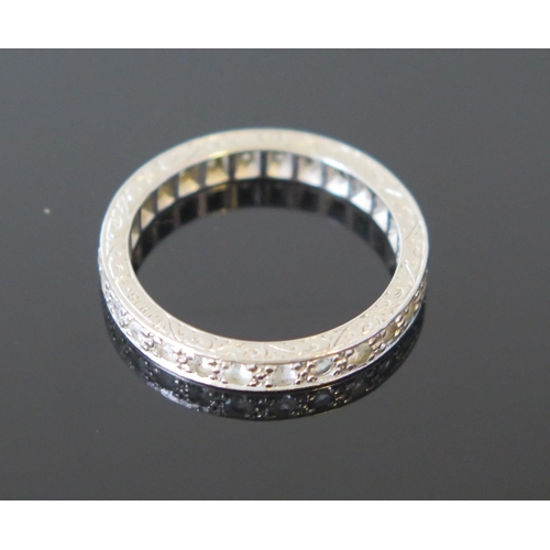 119 - 18ct Gold and White Stone Eternity Ring with chased scroll decoration, 3mm wide, marked JHI 18CT, si... 