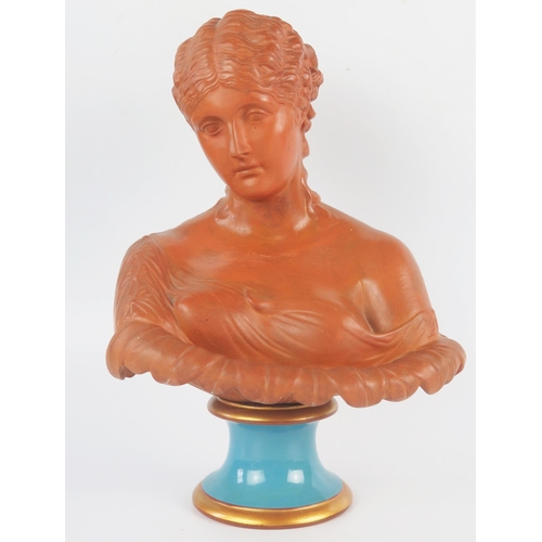 1220 - A Watcombe pottery bust of a neoclassical young lady in traditional robes, on a glazed socle base, 2... 