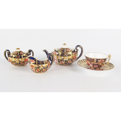 1223 - A Royal Crown Derby miniature part tea service, includes teapot, sucriere and cover, cream jug, cup ... 