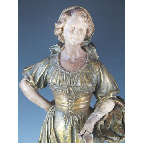 1253 - A large late 19th century French terracotta figure of a female fish seller, wearing a head scarf and... 