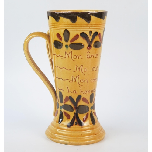 1255 - A Torquay pottery twin handled mug, inscribed with flowerhead Kerswell Daisy decoration (French mott... 