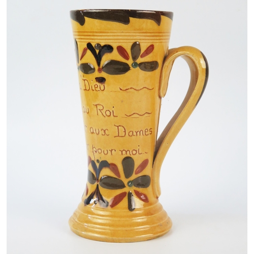 1255 - A Torquay pottery twin handled mug, inscribed with flowerhead Kerswell Daisy decoration (French mott... 