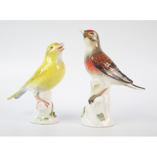 1258 - Two Meissen porcelain finches, perched on tree stumps, 13cm and 12 cm high.
Both with damaged beaks.