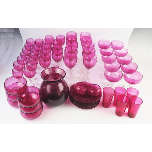 1280 - A Part suite of cranberry glass drinking vessels, including ten champagne glasses, ten wine glasses,... 