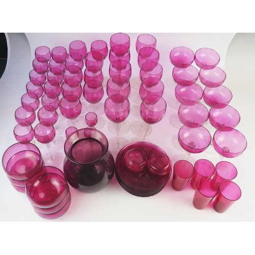 1280 - A Part suite of cranberry glass drinking vessels, including ten champagne glasses, ten wine glasses,... 