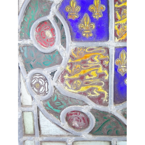 1282 - A stained glass panel depicting the Royal Coat of Arms for Richard III enclosed by red and white ros... 