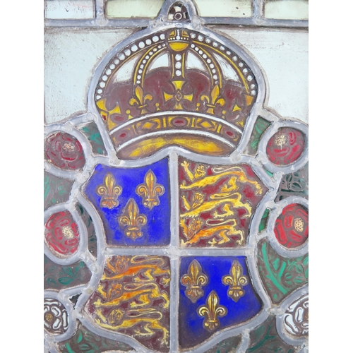 1282 - A stained glass panel depicting the Royal Coat of Arms for Richard III enclosed by red and white ros... 