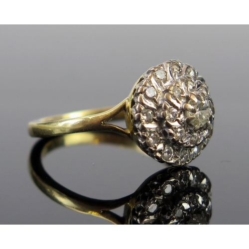 129 - An 18ct Gold and Diamond Cluster Ring, Birmingham marks, 13mm diam. head, size P, 4.9g