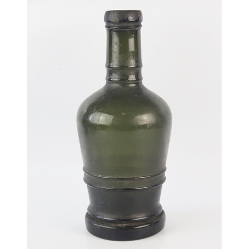 1292 - A late 18th century green glass bottle, with ring banded decoration, 33cm high.