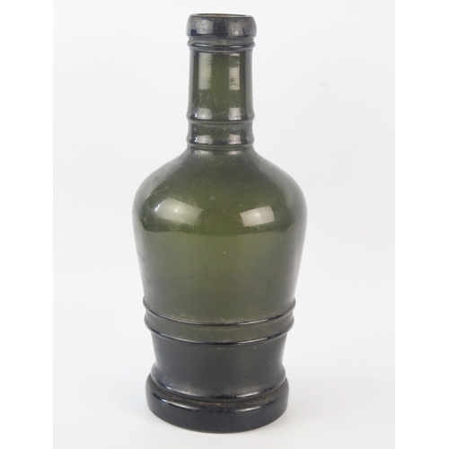 1292 - A late 18th century green glass bottle, with ring banded decoration, 33cm high.