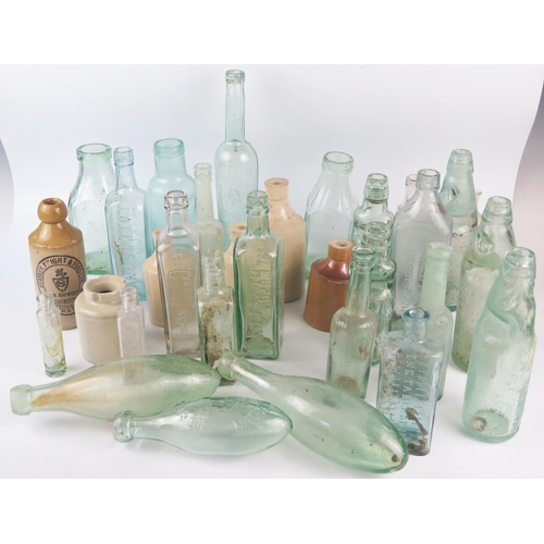 1293 - A collection of assorted glass bottles, including wine bottle, Cod Liver Oil bottle, stoneware bottl... 