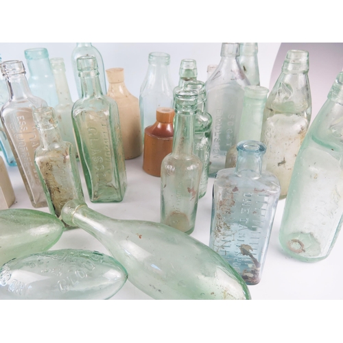 1293 - A collection of assorted glass bottles, including wine bottle, Cod Liver Oil bottle, stoneware bottl... 