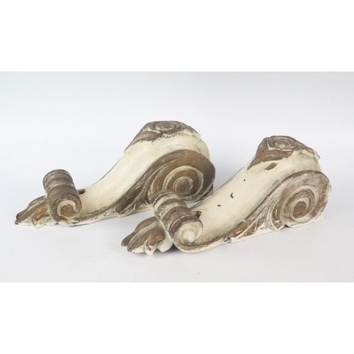 1302 - A pair of carved wood and painted corbels of scroll and foliate design, 30cm high.