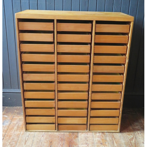 1316 - A plywood collector's chest containing thirty six short drawers, 76.5cm wide.