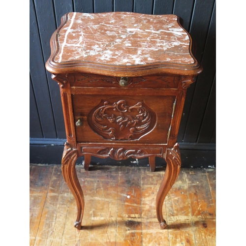 1317 - A French walnut bedside cabinet, of serpentine outline, with inset  marble top, with single short dr... 