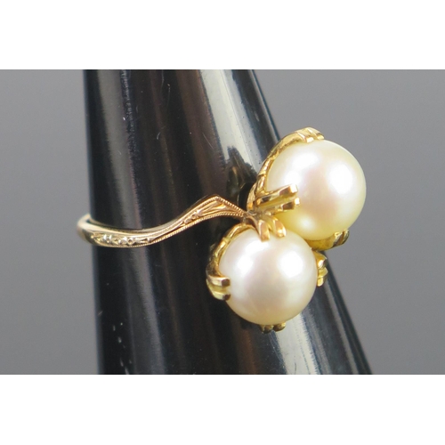 132 - A K18 Gold and Twin Pearl (untested) Cross Over Ring with chased and millegrain decoration to the sh... 