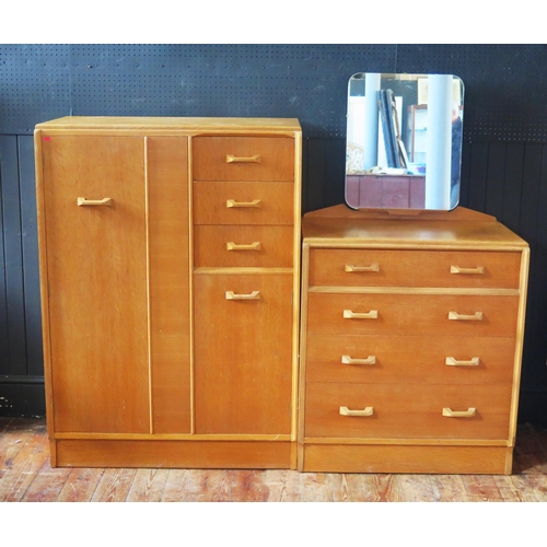 1320 - A G-Plan E. Gomme bedroom suite comprising a dressing chest with adjustable mirror plate, containing... 