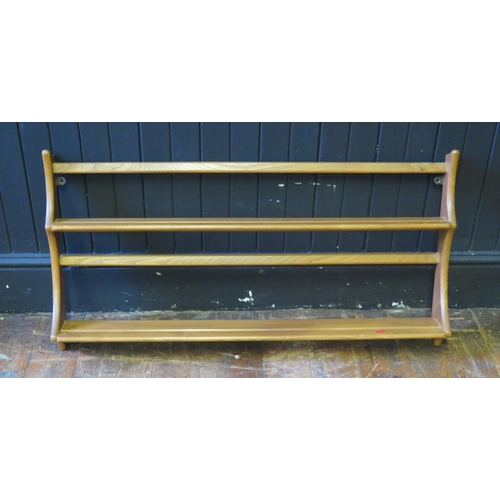 1322 - An Ercol open plate rack, with two graduated shelves and open back, 96cm wide.