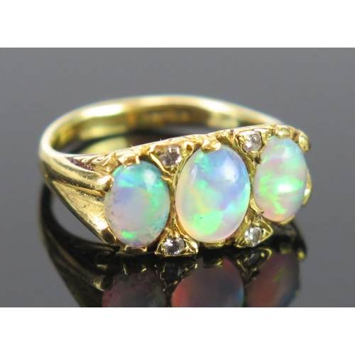 133 - An 18ct Gold and Opal and Diamond Ring with scrolling claw setting, c. 8x6mm singlet stone, full Bir... 