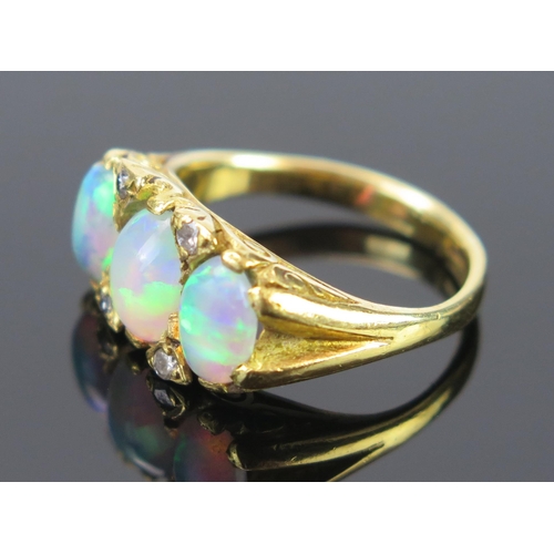 133 - An 18ct Gold and Opal and Diamond Ring with scrolling claw setting, c. 8x6mm singlet stone, full Bir... 