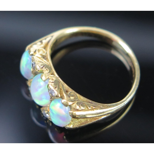 133 - An 18ct Gold and Opal and Diamond Ring with scrolling claw setting, c. 8x6mm singlet stone, full Bir... 