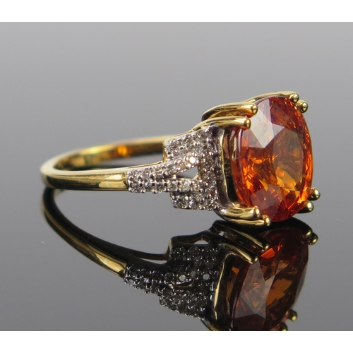 138 - A Modern 18ct Gold, Diamond and Orange Stone Dress Ring, c. 11x9.3mm stone, Birmingham marks, size N... 