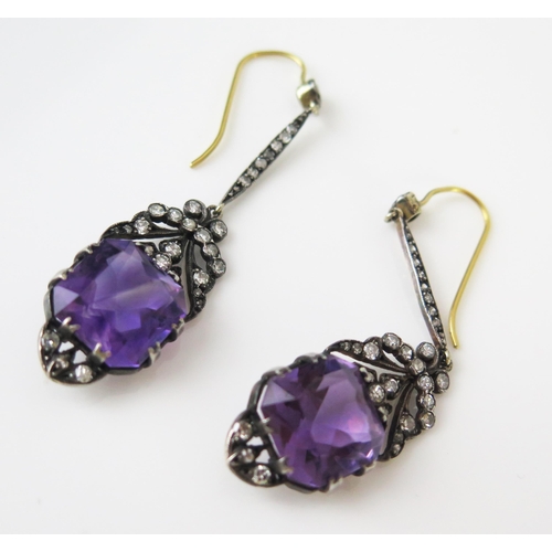 147 - A Pair of Vintage Amethyst and Diamond Pendant Earrings in a white metal setting with yellow metal h... 