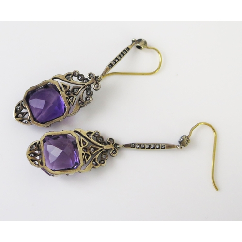 147 - A Pair of Vintage Amethyst and Diamond Pendant Earrings in a white metal setting with yellow metal h... 